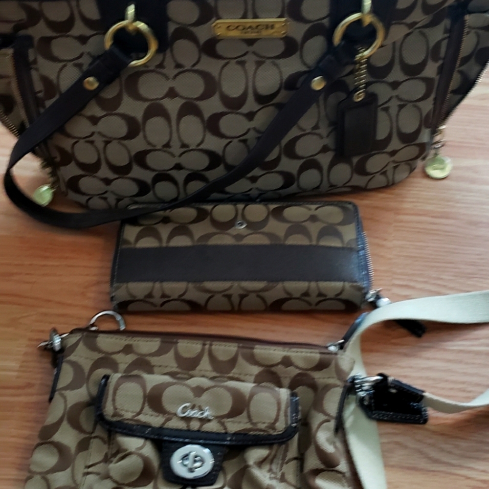 Two Coach purses and a Coach wallet